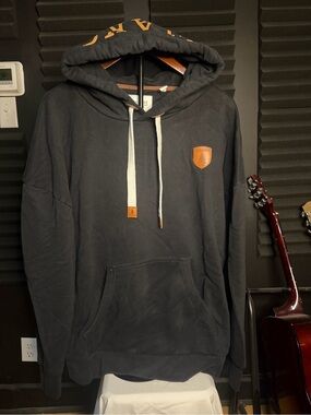 Wanakome Black Pullover Hoodie with Tan Patch